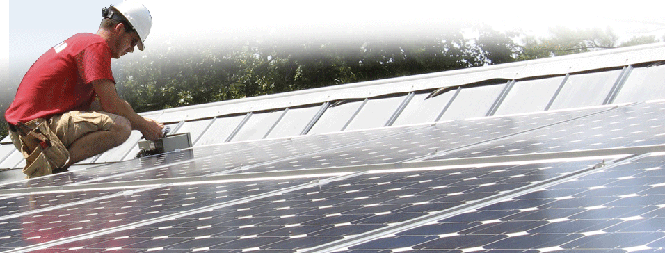 PVIP On the Job Photo of Solar Installer working on a roof with PV Panels